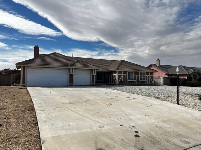 single story home featuring a garage