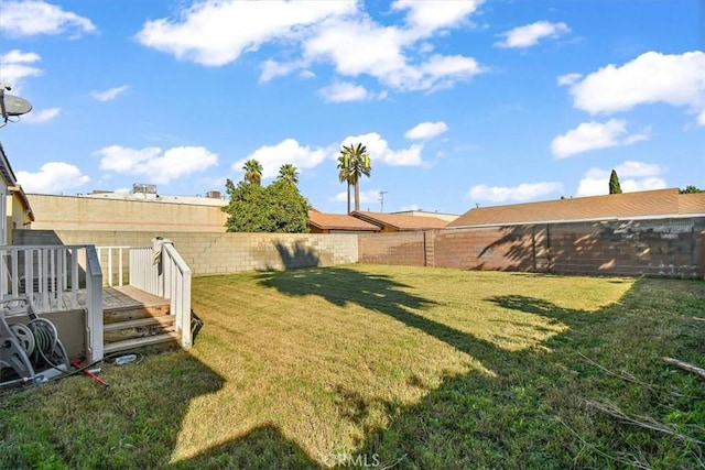 view of yard with a wooden deck