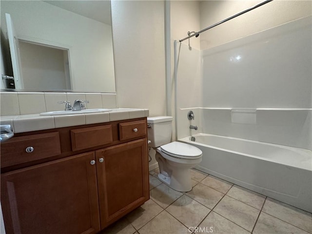 full bathroom featuring bathing tub / shower combination, tile patterned flooring, vanity, and toilet