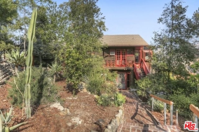 view of front of property with a wooden deck