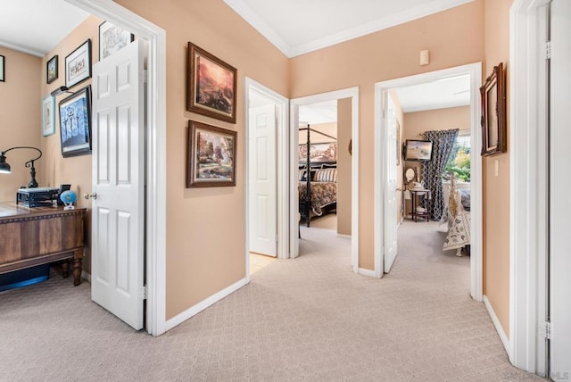 hall featuring crown molding and light colored carpet