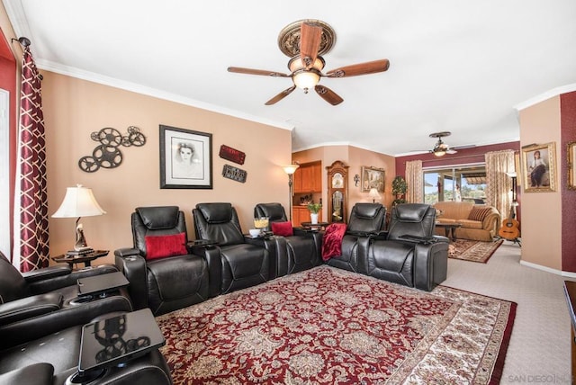 carpeted cinema featuring ceiling fan and crown molding