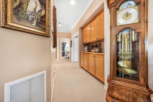 hallway featuring light carpet and ornamental molding