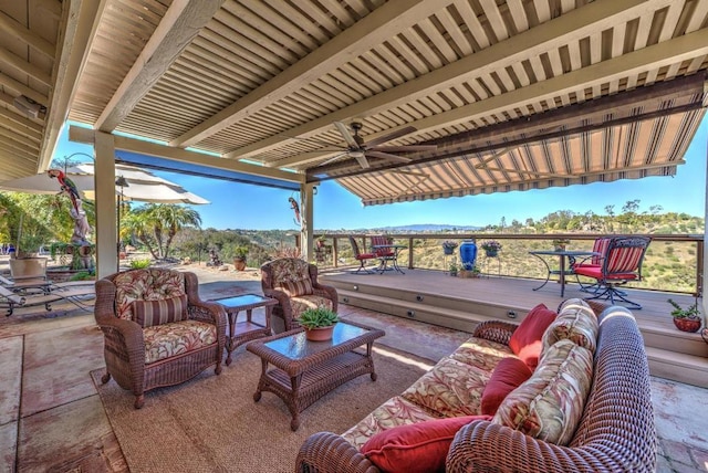 view of patio featuring an outdoor living space and a wooden deck