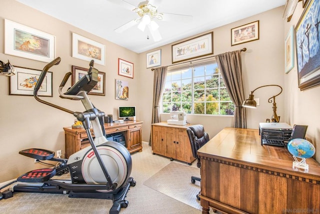 office space featuring ceiling fan and light colored carpet