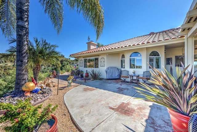 rear view of house with a patio