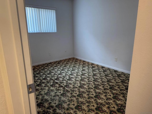 empty room featuring carpet flooring