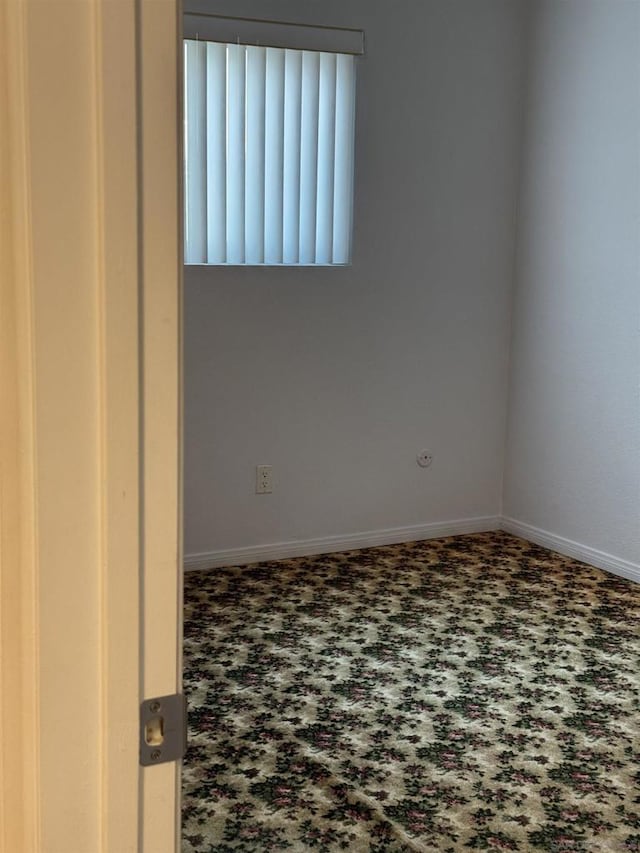 spare room featuring carpet flooring