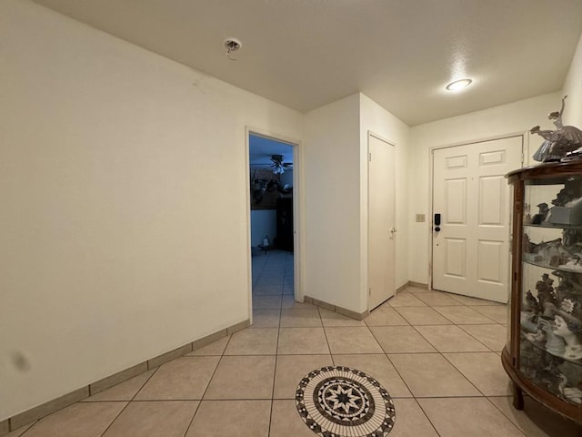 corridor with light tile patterned floors