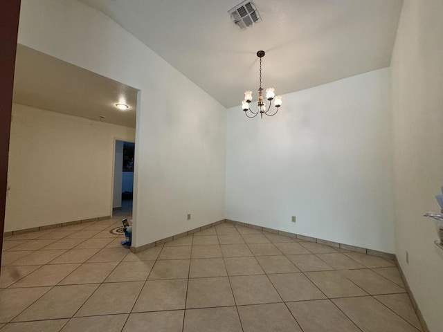 unfurnished room featuring light tile patterned floors, lofted ceiling, and a notable chandelier