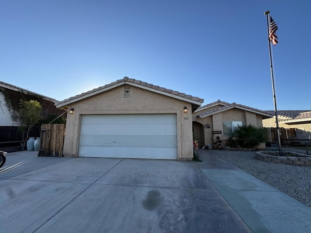 single story home with a garage