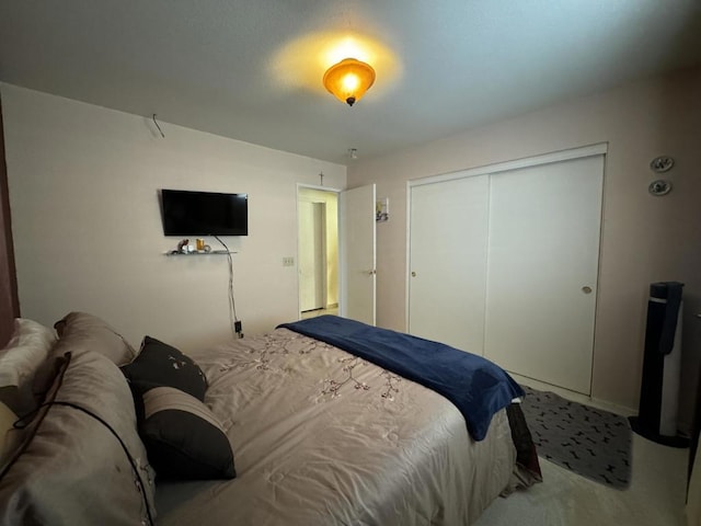 carpeted bedroom featuring a closet