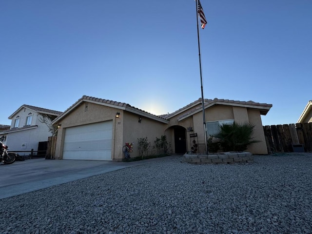 ranch-style home with a garage