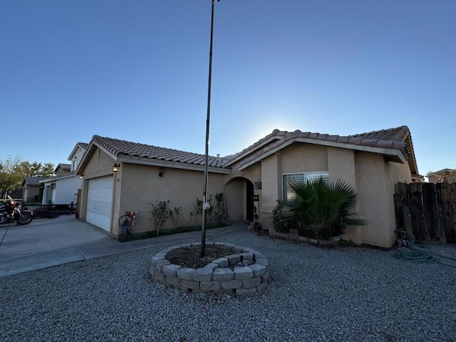 ranch-style house featuring a garage