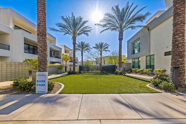 view of property's community featuring a yard