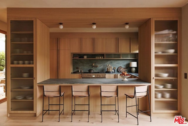 bar featuring light hardwood / wood-style floors