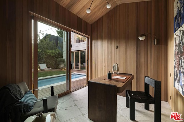 home office with wood walls, lofted ceiling, and wood ceiling