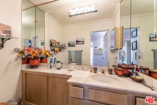 bathroom featuring vanity and ornamental molding