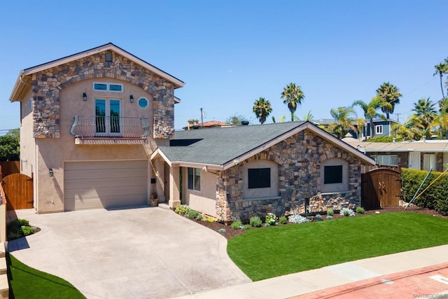 view of front of home with a front yard, a balcony, and a garage