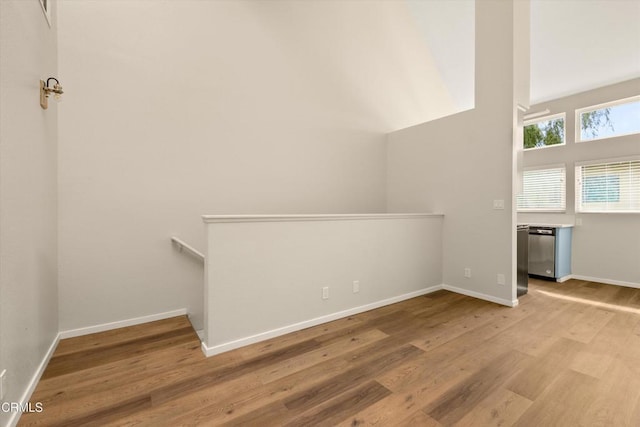 additional living space featuring light hardwood / wood-style floors