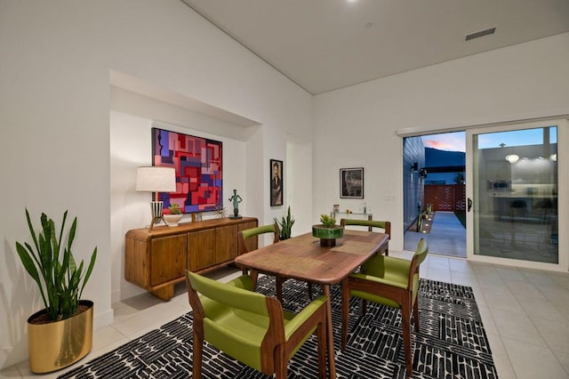 dining area featuring light tile patterned floors