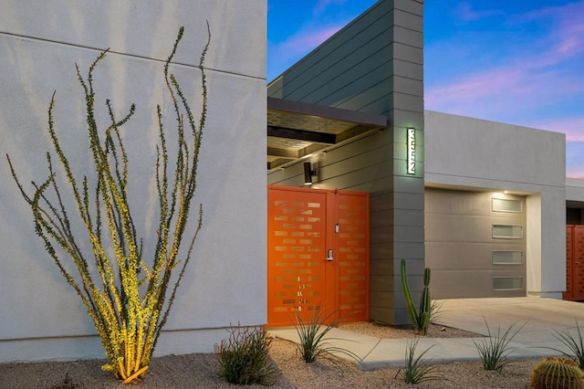 property exterior at dusk with a garage