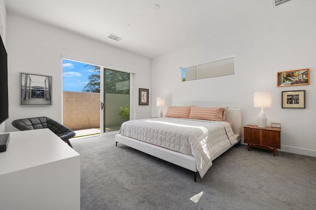 carpeted bedroom with access to exterior