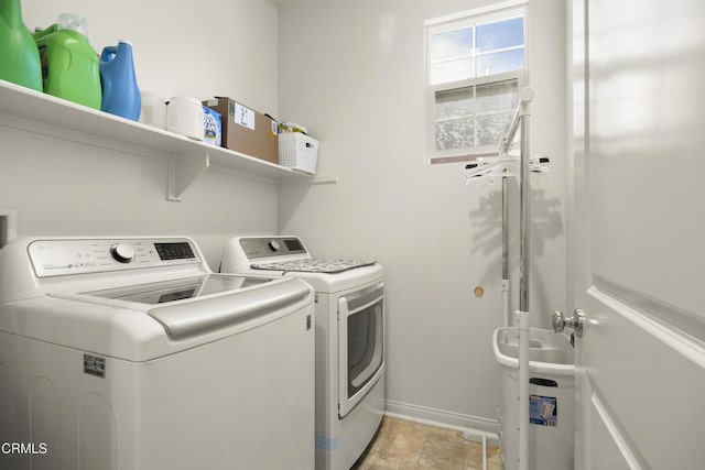 laundry room with washer and clothes dryer