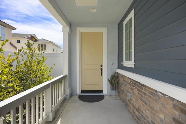 entrance to property featuring a balcony