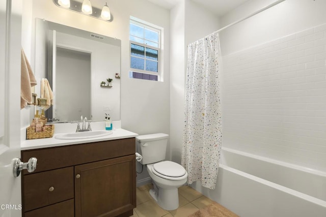 full bathroom with tile patterned floors, shower / bathtub combination with curtain, vanity, and toilet