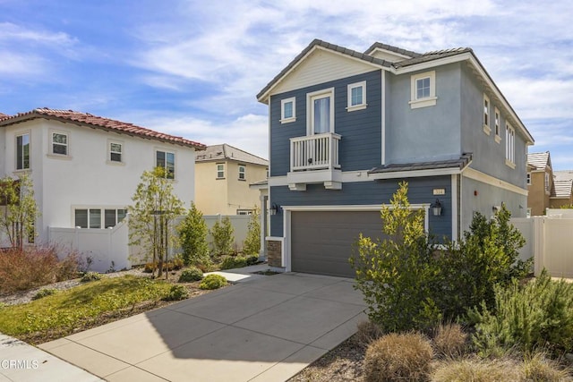 view of front of home with a balcony and a garage