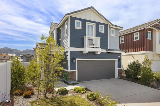 view of front facade featuring a mountain view and a garage