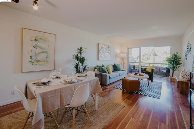 dining room with hardwood / wood-style floors