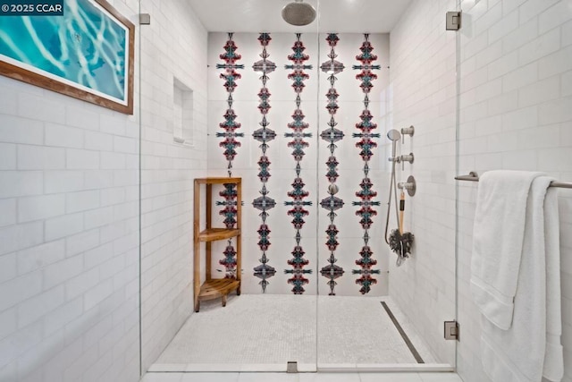 bathroom featuring tile patterned flooring and walk in shower