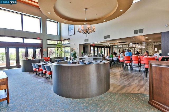 reception with french doors and a chandelier