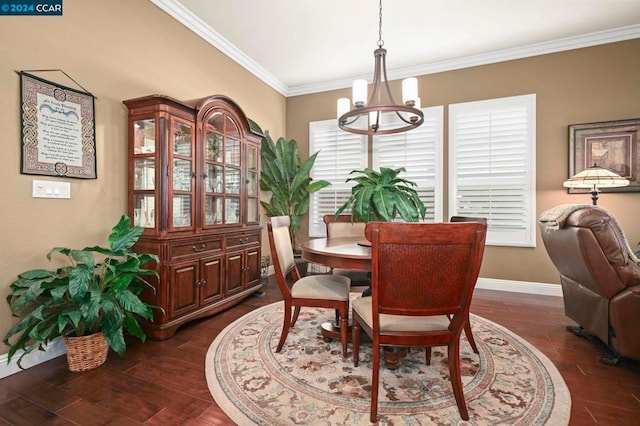 dining area featuring dark hardwood / wood-style flooring, a wealth of natural light, ornamental molding, and a notable chandelier