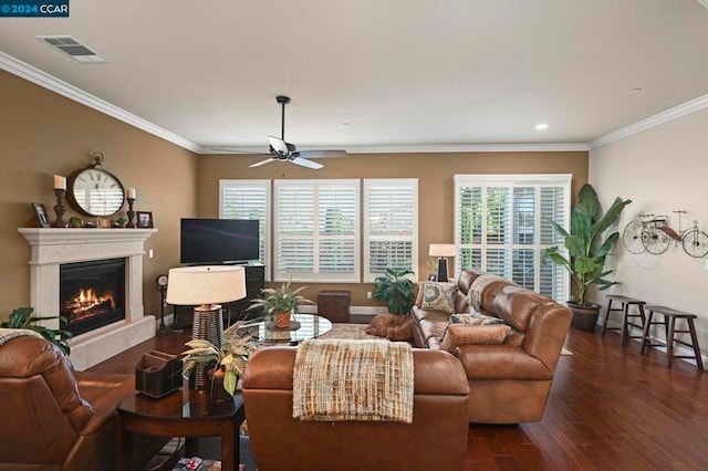 living room with ceiling fan, dark wood-type flooring, and ornamental molding