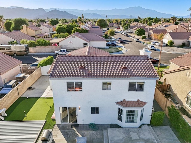 birds eye view of property featuring a mountain view