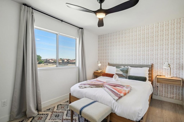 bedroom featuring ceiling fan and light hardwood / wood-style flooring