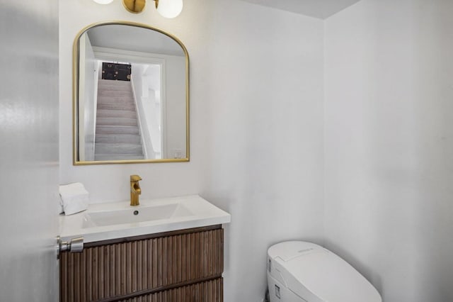 bathroom with vanity and toilet