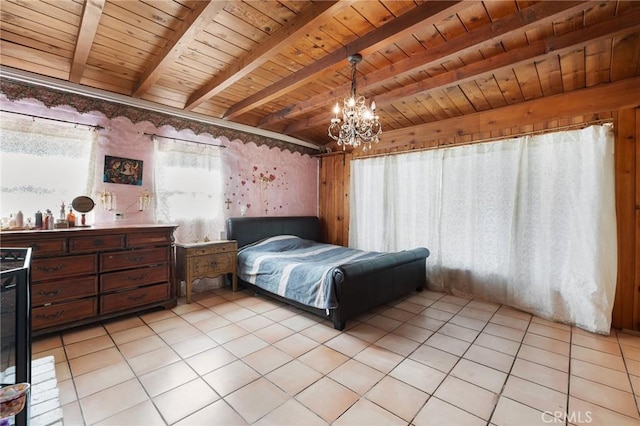 bedroom featuring beamed ceiling, light tile patterned floors, wood ceiling, and an inviting chandelier