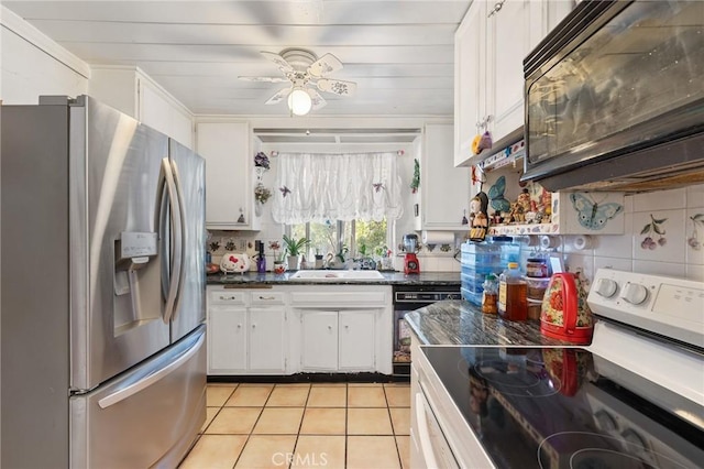 kitchen featuring backsplash, black appliances, white cabinets, sink, and ceiling fan