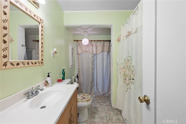 bathroom featuring tile patterned floors, vanity, and toilet