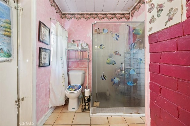 bathroom featuring toilet, tile patterned floors, and a shower with shower door