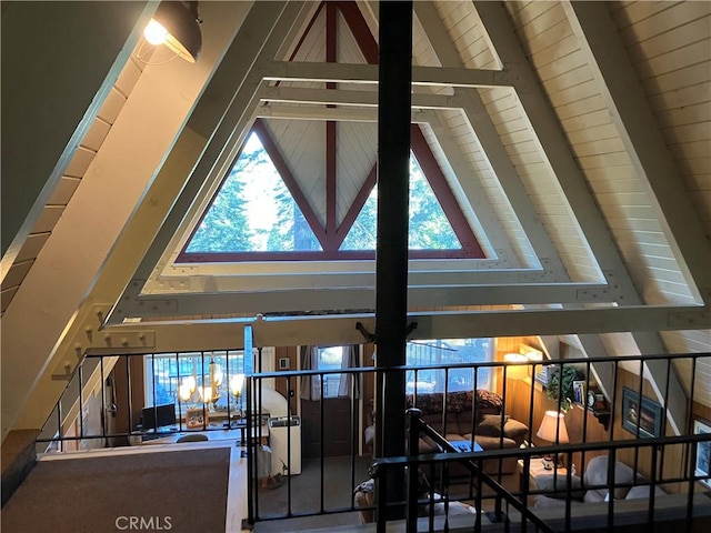 details featuring beam ceiling and a chandelier