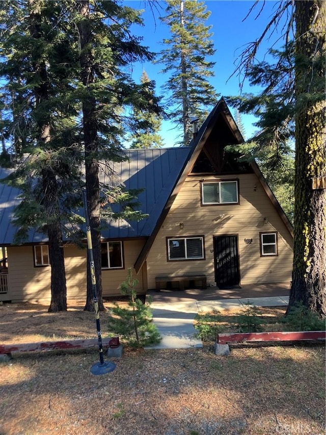 view of front of property featuring a patio