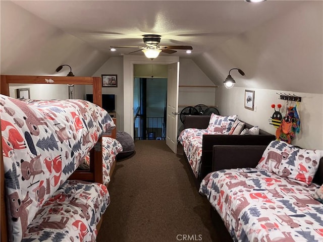 bedroom with ceiling fan, lofted ceiling, and dark colored carpet