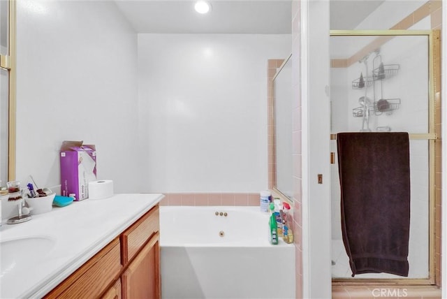 bathroom with shower with separate bathtub and vanity