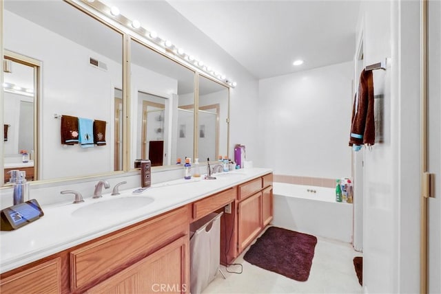 bathroom with plus walk in shower and vanity