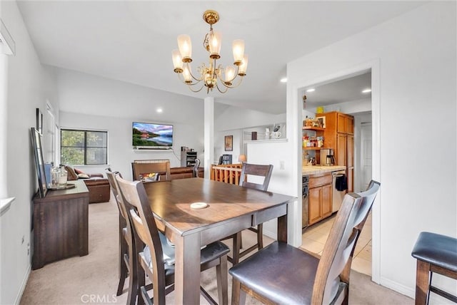 dining area with light colored carpet and a chandelier